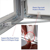 Enclosed 24 by 36 LOCKABLE outdoor poster case has a supportive bar when opening, and has clips for easily inserting posters.